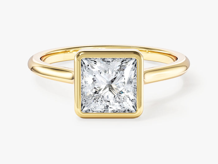 Princess cut lab grown diamond bezel set solitaire engagement ring in yellow gold, front view