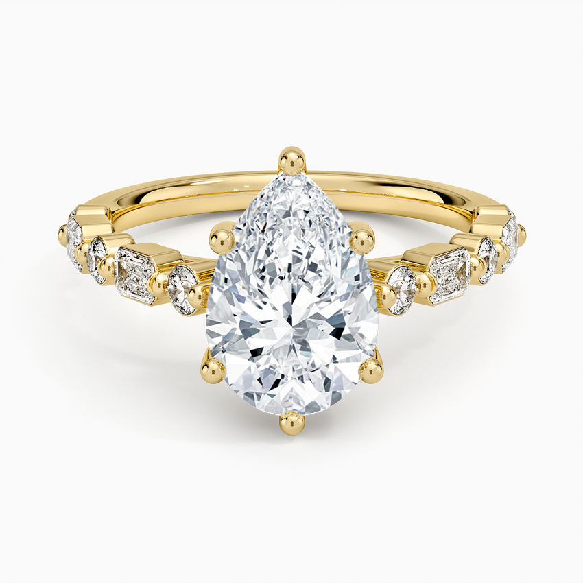 Pear cut moissanite ring with alternating bar set baguettes and ovals, top view