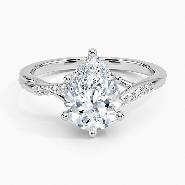 Pear cut moissanite crossover graduated pave engagement ring in white gold, top view