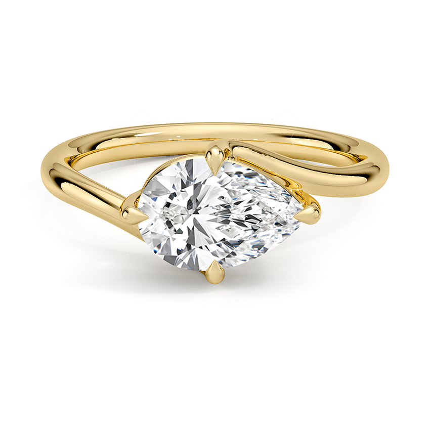 East west set pear cut moissanite on an open bypass shank in yellow gold, top view