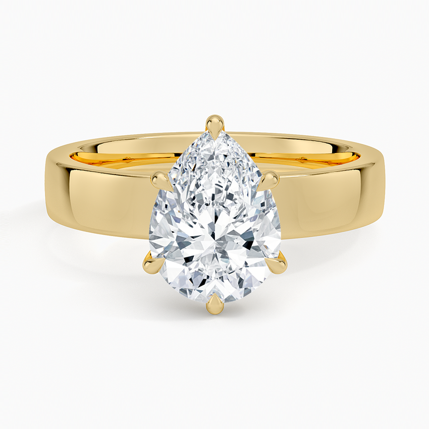 Pear cut moissanite in six claws on a wide flat square edged band in yellow gold, top view