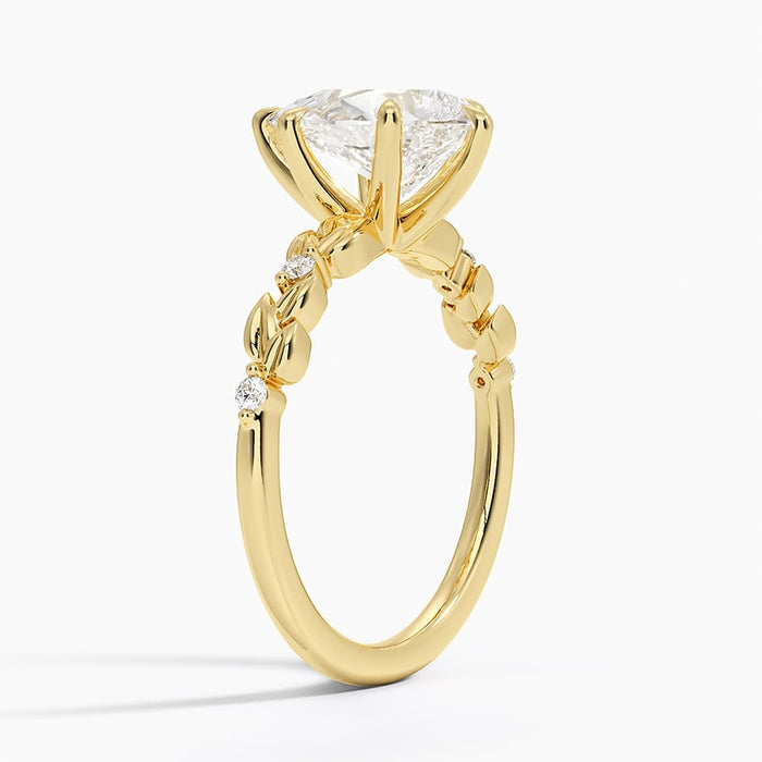 Side view showing the solid sculpted leaves alternating with bezel set rounds
