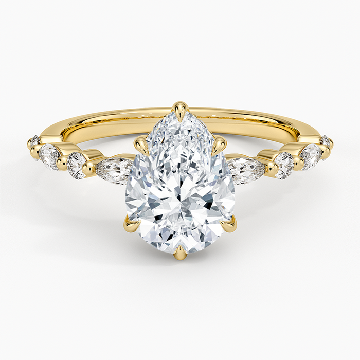 Pear cut moissanite with alternating marquise and round accents in yellow gold, top view