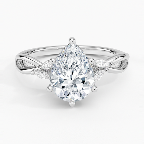 Pear cut moissanite on an infinity crossover shank with marquise petal accents in white gold, top view