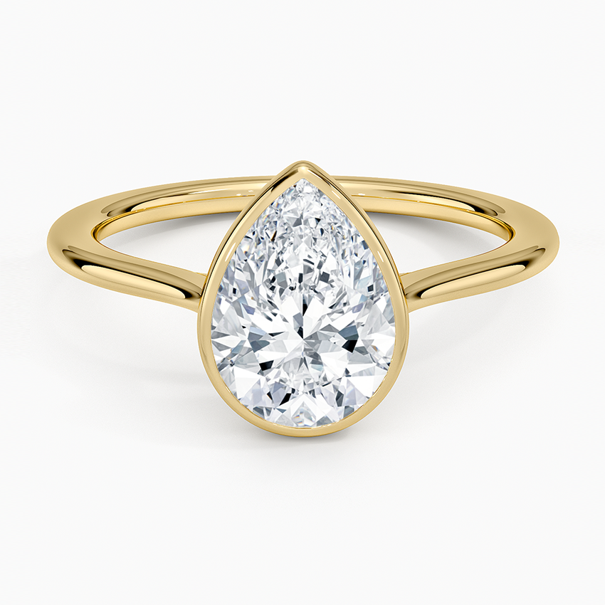 Pear cut moissanite low smooth bezel engagement ring in yellow gold, top view