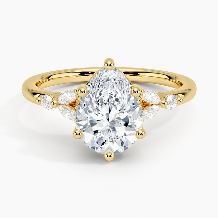 Pear cut moissanite marquise petal fan engagement ring in yellow gold, top view