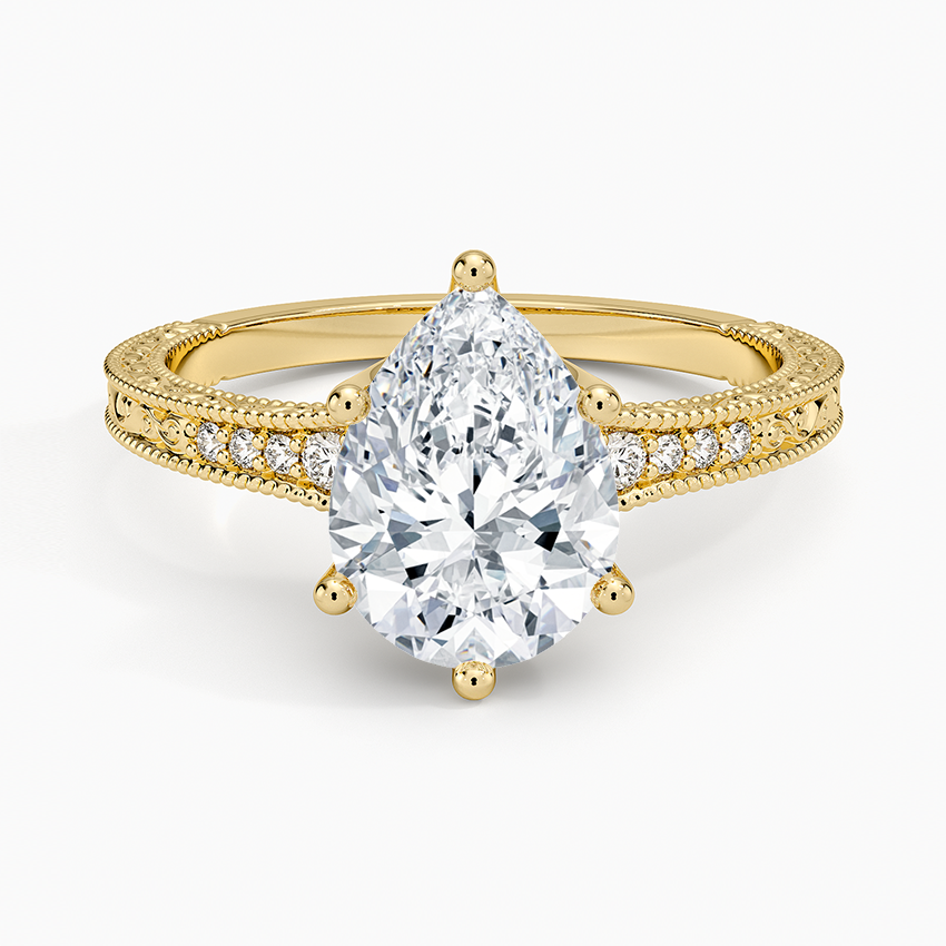 Pear cut moissanite milgrain pave engraved side engagement ring in yellow gold, top view