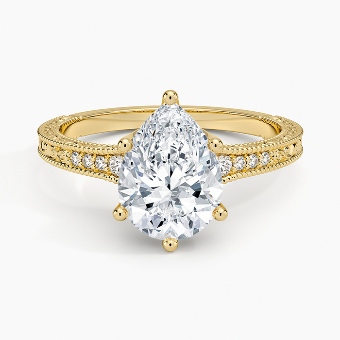 Pear cut moissanite milgrain pave engraved side engagement ring in yellow gold, top view