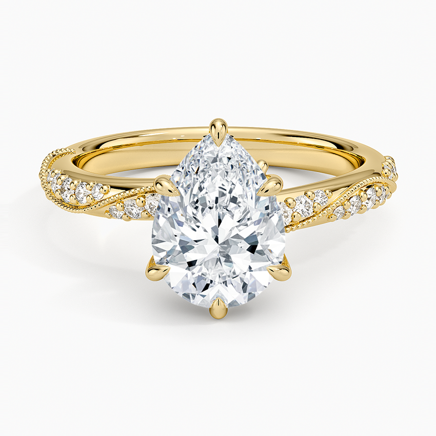 Pear cut moissanite milgrain twisted pave engagement ring in yellow gold, top view