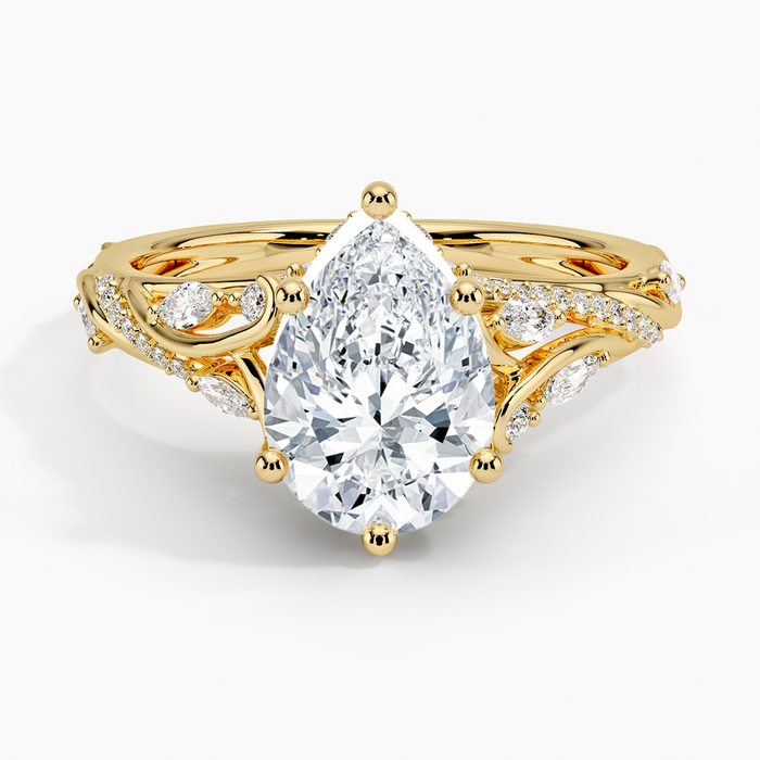 Pear cut moissanite ornate openwork vine engagement ring in yellow gold, top view