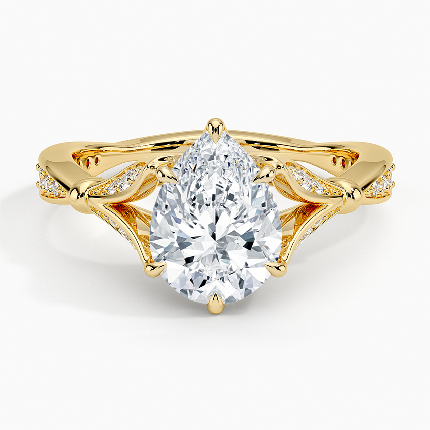 Pear cut moissanite pave leaf openwork engagement ring in yellow gold, top view