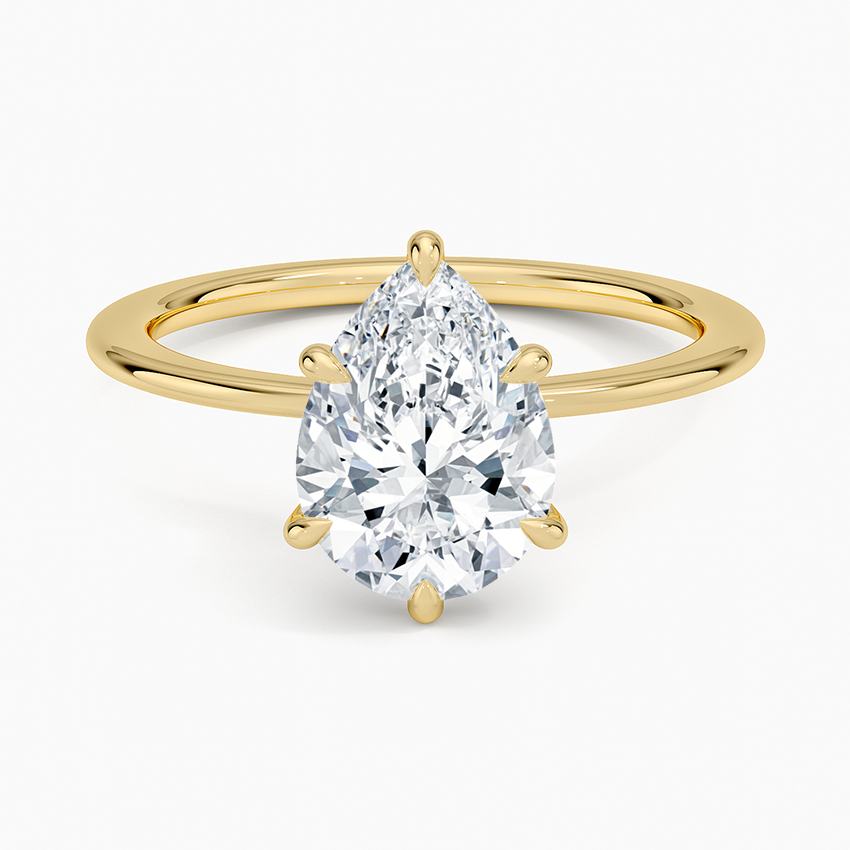 Pear cut moissanite plain band hidden halo engagement ring in yellow gold, top view