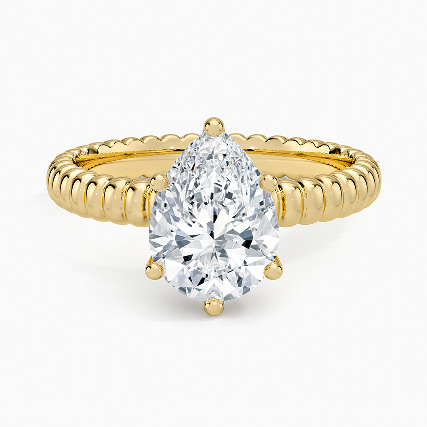 Pear cut moissanite rope twist band engagement ring in yellow gold, top view