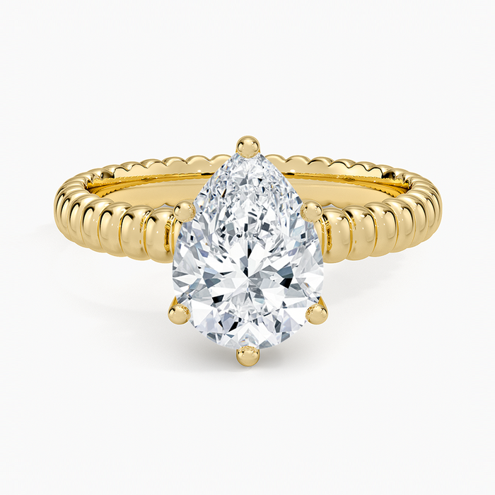Pear cut moissanite rope twist band engagement ring in yellow gold, top view