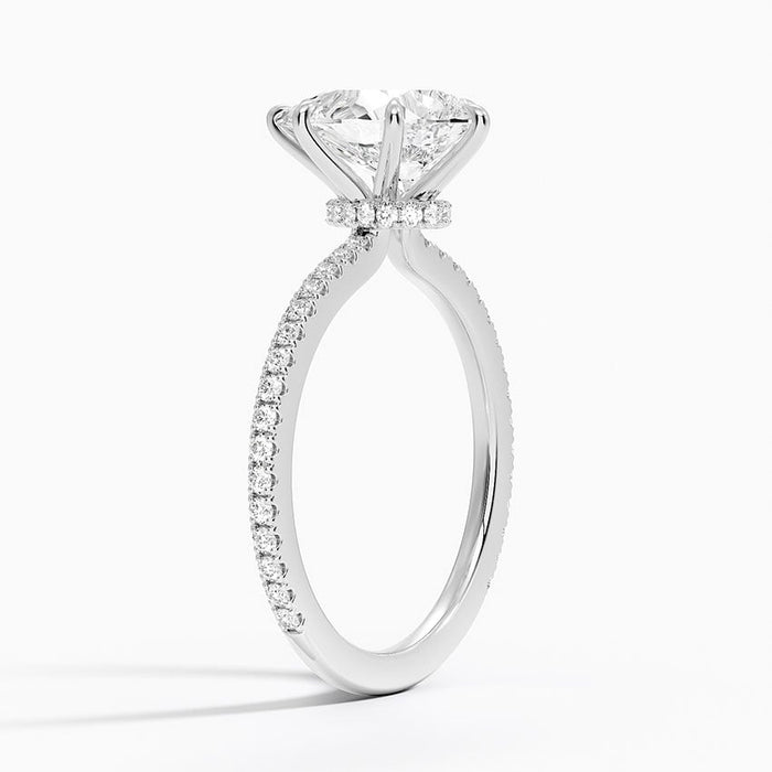 Side view showing the hidden halo under the setting and scalloped pave band