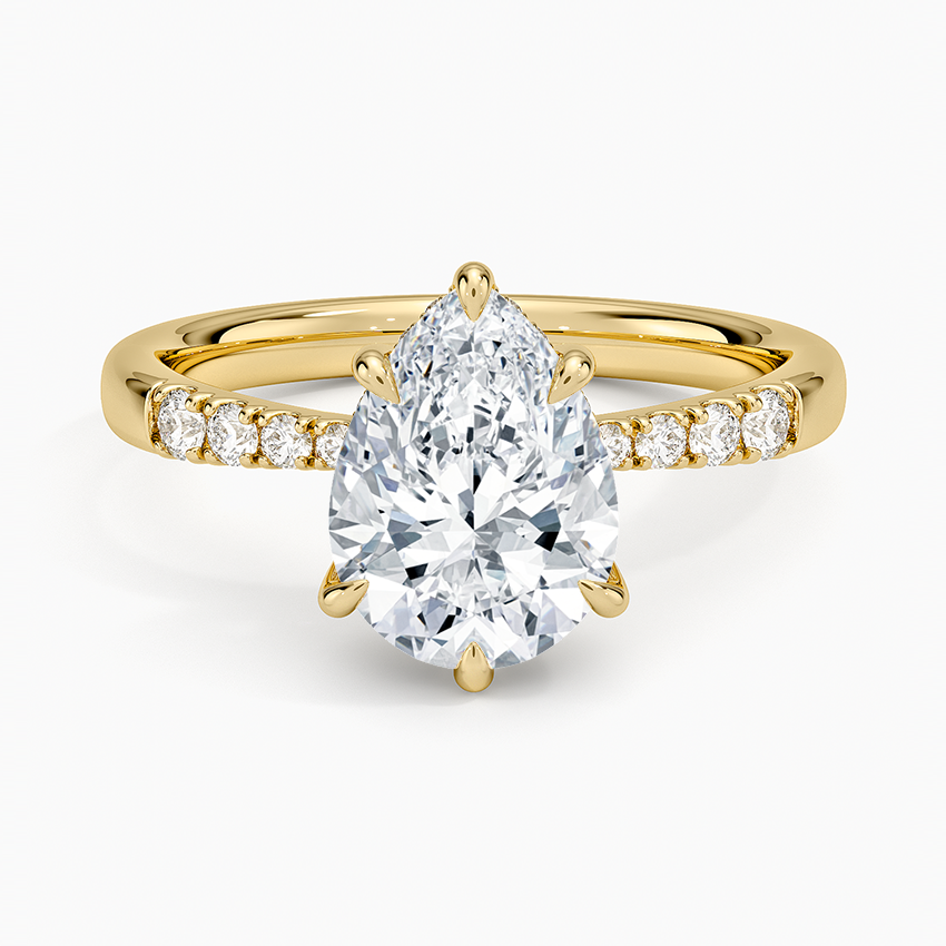 Pear cut moissanite shared prong hidden halo engagement ring in yellow gold, top view