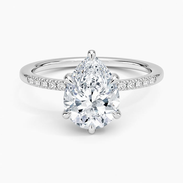 Pear cut moissanite slim pave hidden halo engagement ring in white gold, top view
