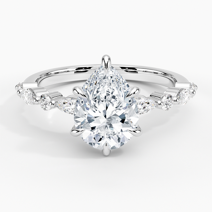 Pear cut moissanite with alternating spaced marquise and round accents in white gold, top view