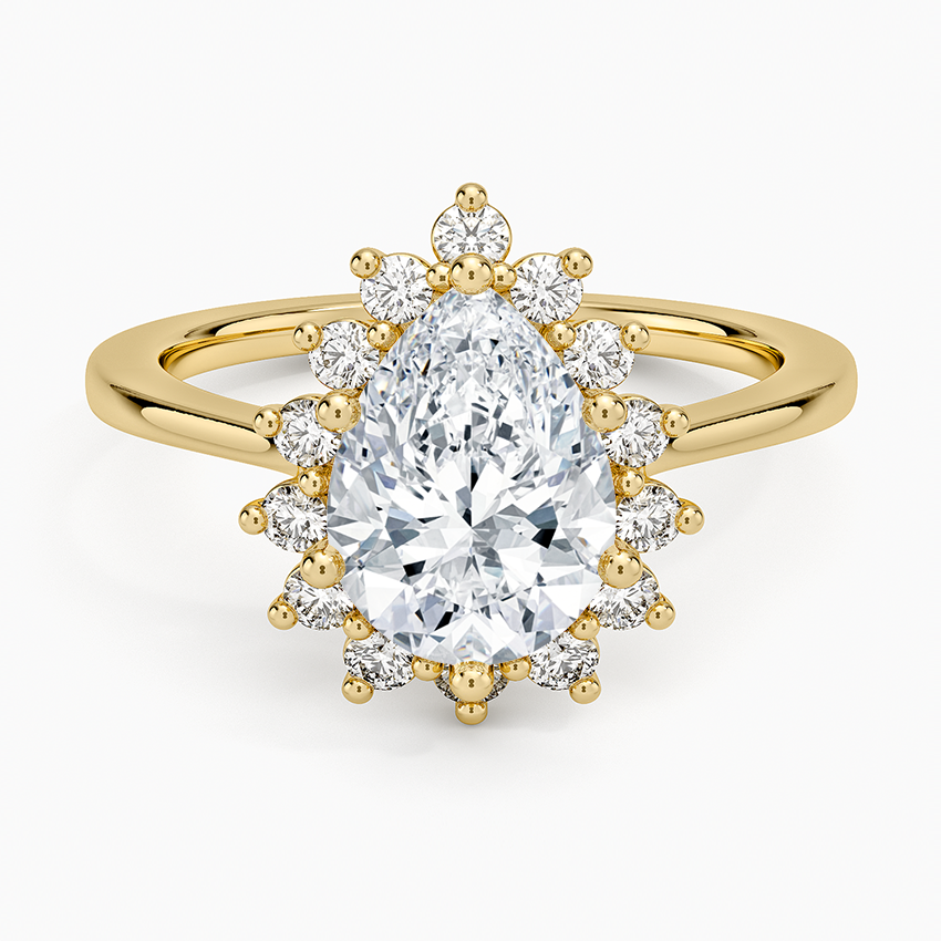 Pear cut moissanite sunburst claw set halo engagement ring in yellow gold, top view