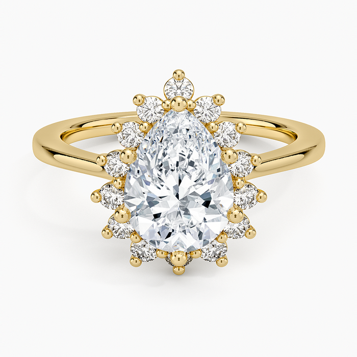 Pear cut moissanite sunburst claw set halo engagement ring in yellow gold, top view