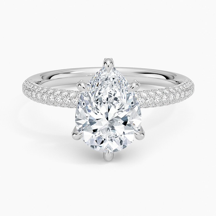 Pear cut moissanite three sided pave engagement ring in white gold, top view