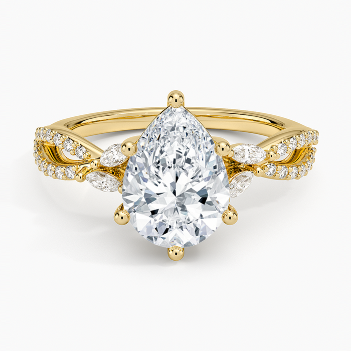 Pear cut moissanite twisted pave engagement ring with marquise leaf accents in yellow gold, top view