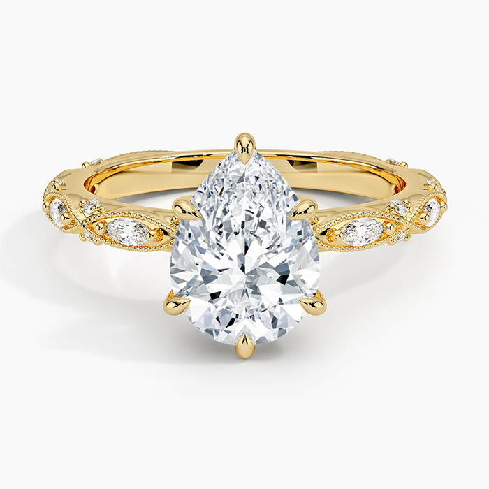Pear cut moissanite vintage milgrain marquise band engagement ring in yellow gold, top view