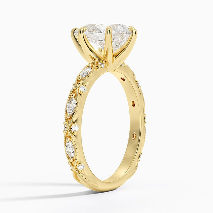 Side view showing the milgrain framed marquise panels and engraved shoulders
