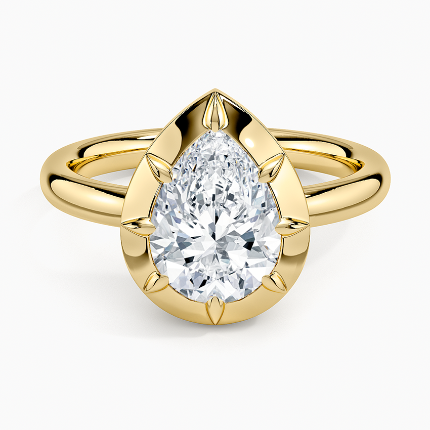 Pear cut moissanite in a wide polished bezel cup with six sculpted claws in yellow gold, top view