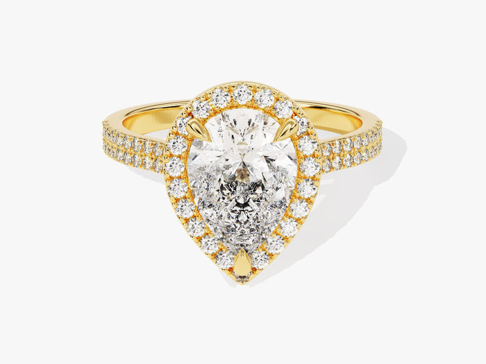Pear cut moissanite halo engagement ring with double row pave band in yellow gold, front view