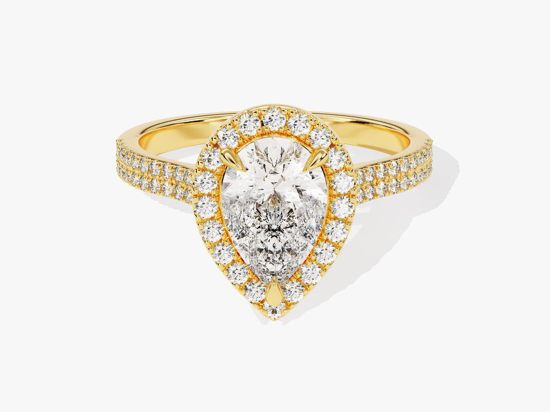 Teardrop pear moissanite halo engagement ring with two row pave band in yellow gold