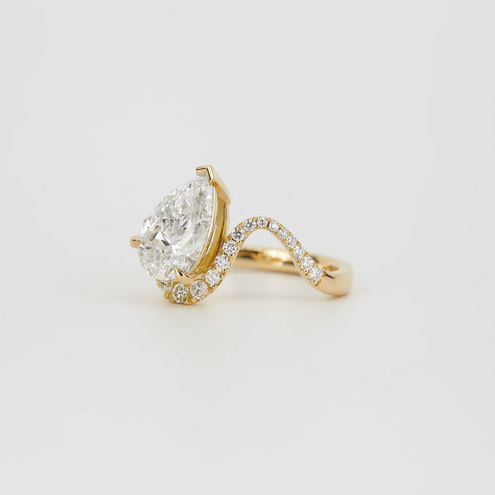 Pear cut moissanite half halo chevron pave engagement ring in yellow gold, view 2