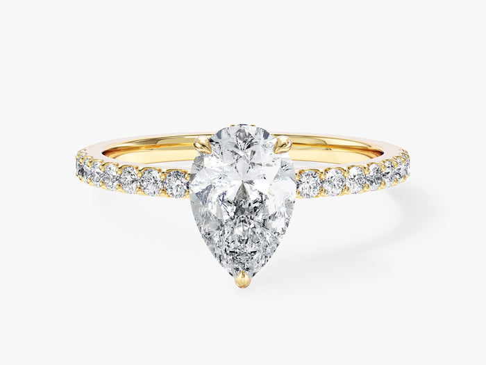 Pear cut moissanite pave band engagement ring with hidden halo in 14K yellow gold, front view