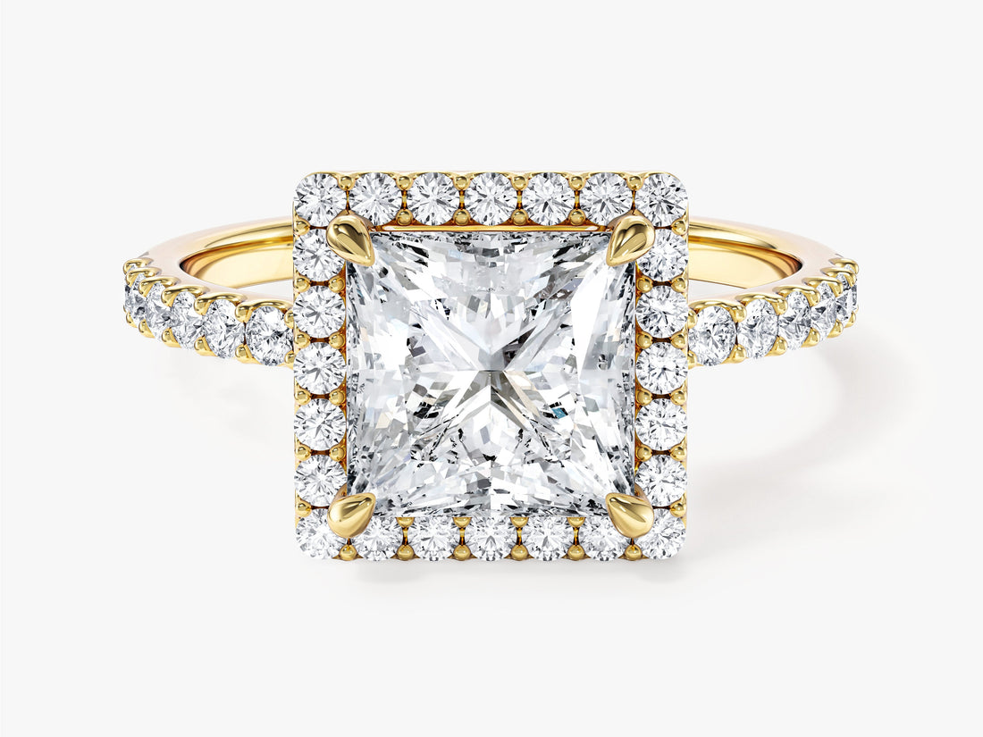 Square princess moissanite halo engagement ring with corner claws and pave shoulders in 14K yellow gold, front view