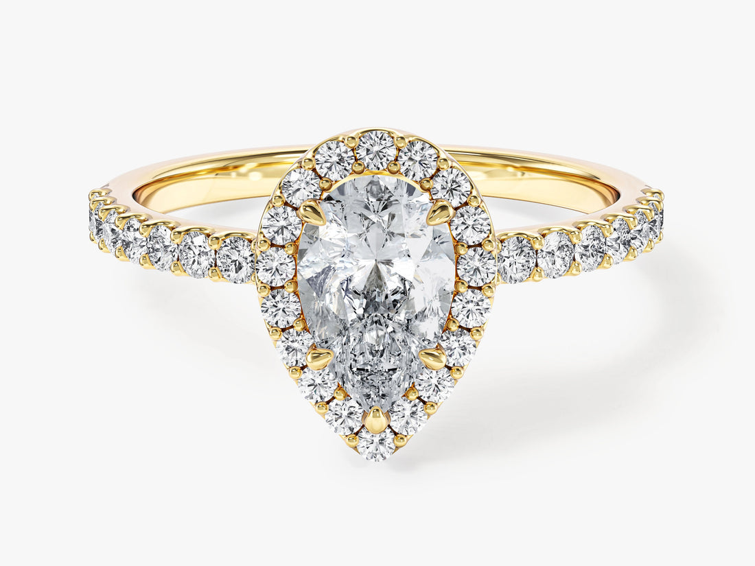 Pear cut lab grown diamond three claw halo ring with micro pave band in yellow gold, front view