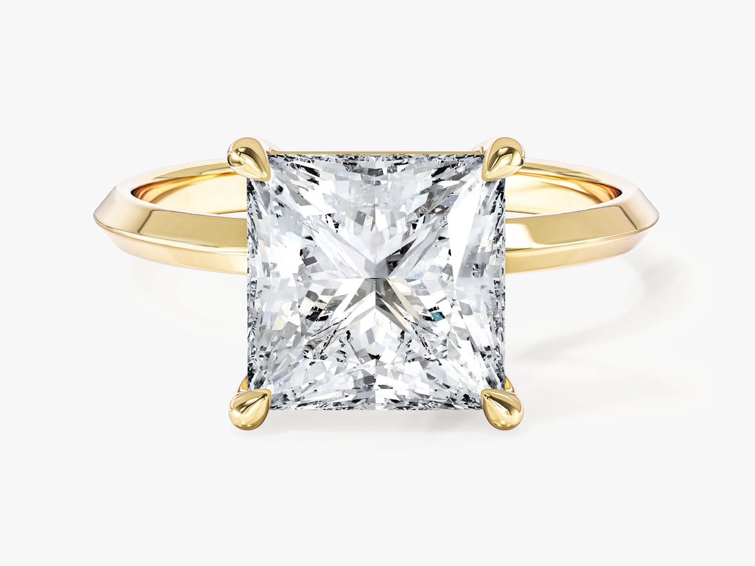 High set princess cut lab grown diamond statement solitaire with knife edge band in yellow gold, front view