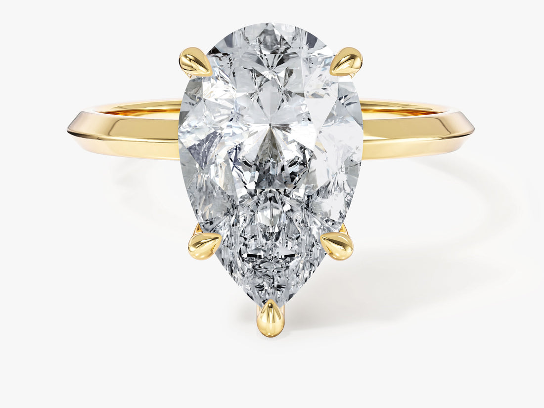 Large pear lab grown diamond statement ring with knife edge shank in yellow gold, front view