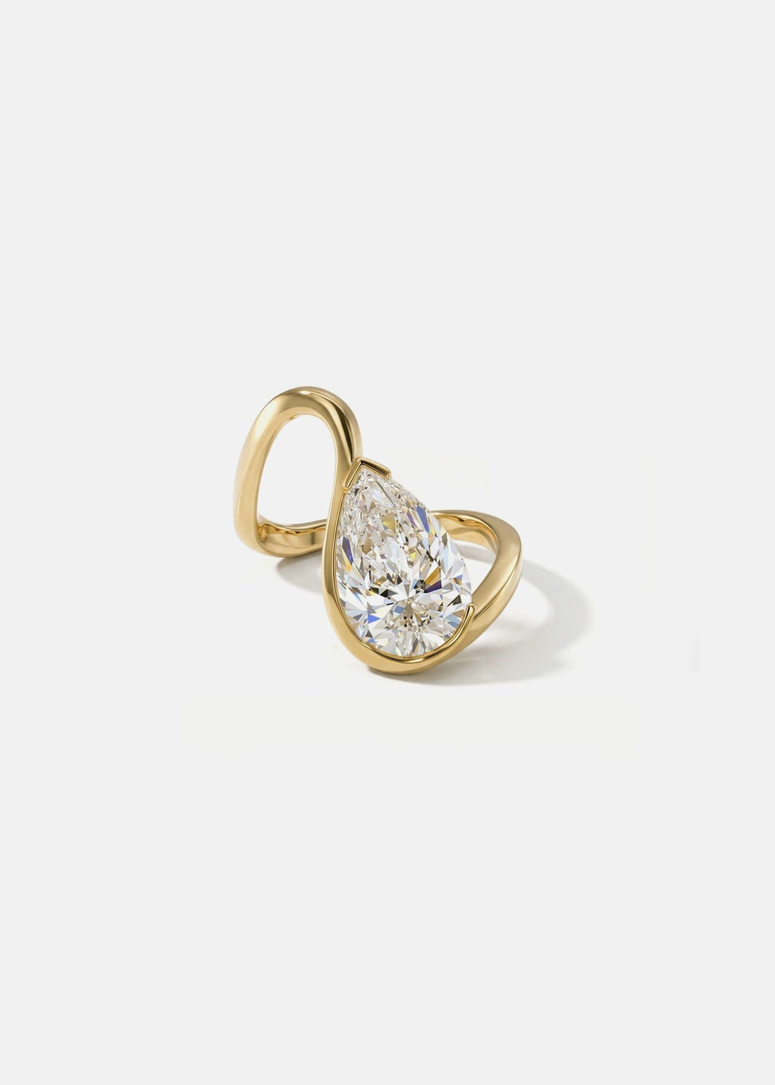 Pear cut moissanite open loop half bezel engagement ring in yellow gold