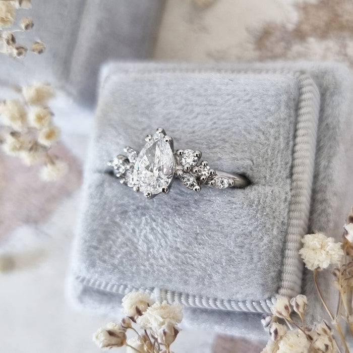 Pear cut moissanite mixed cut cluster engagement ring in eight fine claws in white gold, view 2