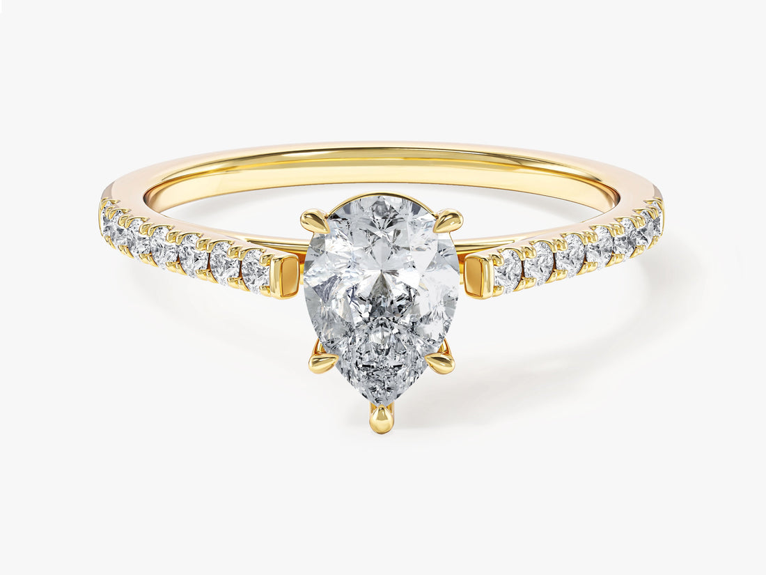 Dainty pear moissanite pave solitaire engagement ring on a thin band in yellow gold, front view