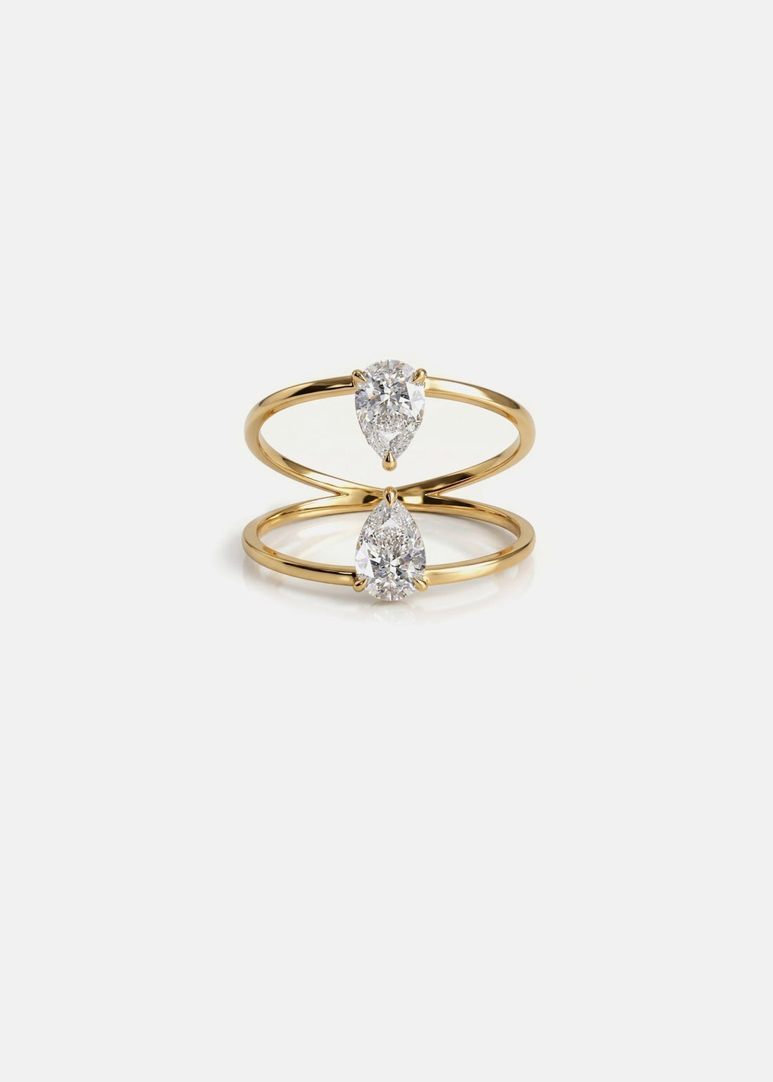 Two pear cut moissanite engagement ring on a plain double band in yellow gold