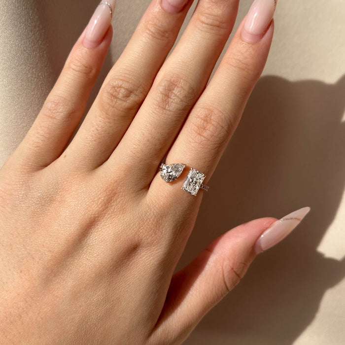 Pear and radiant moissanite toi et moi open shank engagement ring in white gold