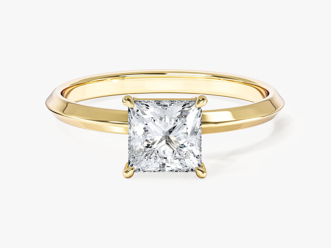 Minimalist princess moissanite knife edge engagement ring in yellow gold, front view