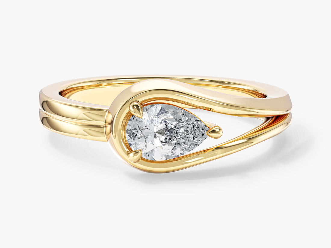 Pear lab grown diamond split shank loop engagement ring in yellow gold, front view