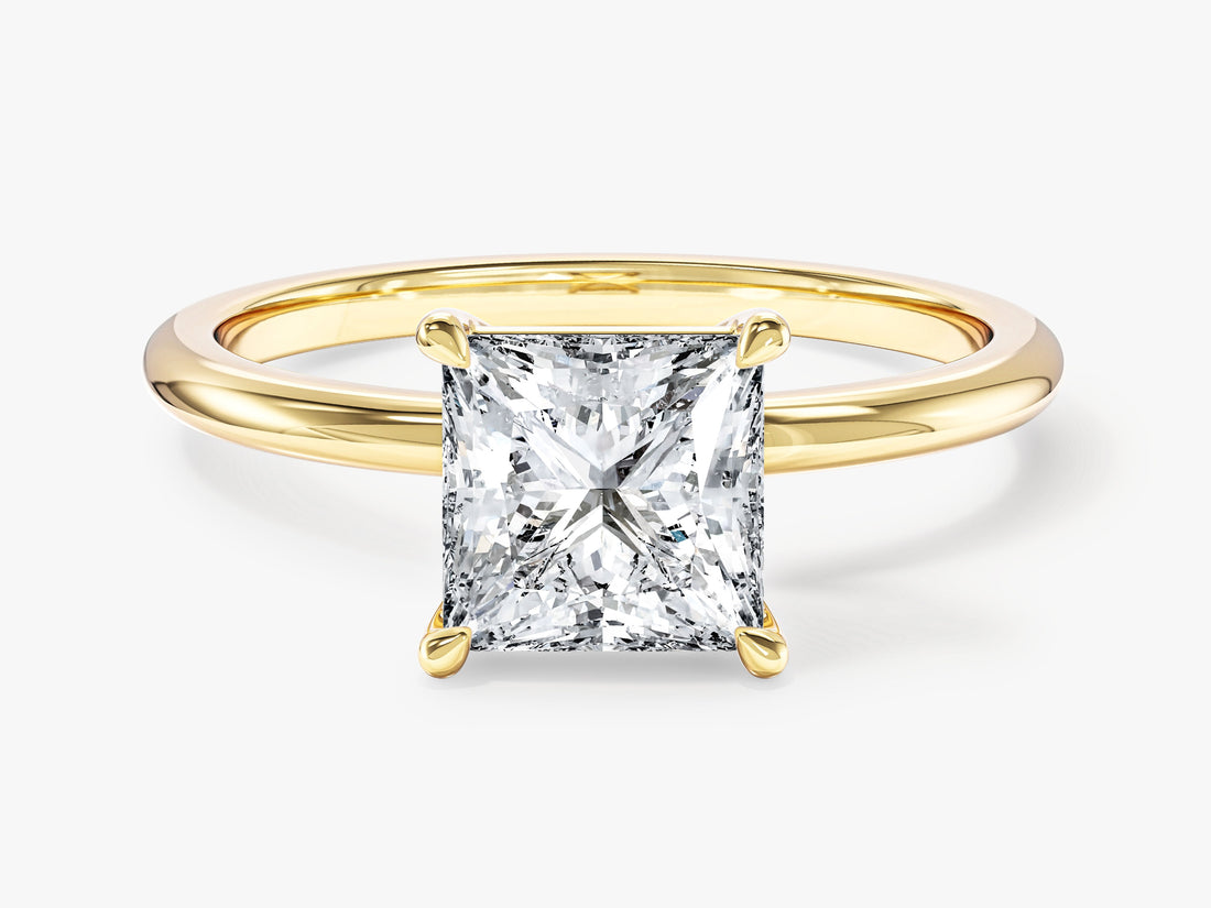 Princess cut moissanite solitaire engagement ring with plain round band in 14K yellow gold, front view