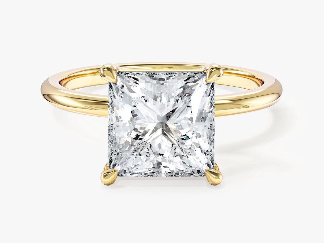 Large princess cut moissanite corner claw solitaire engagement ring in 14K yellow gold, front view