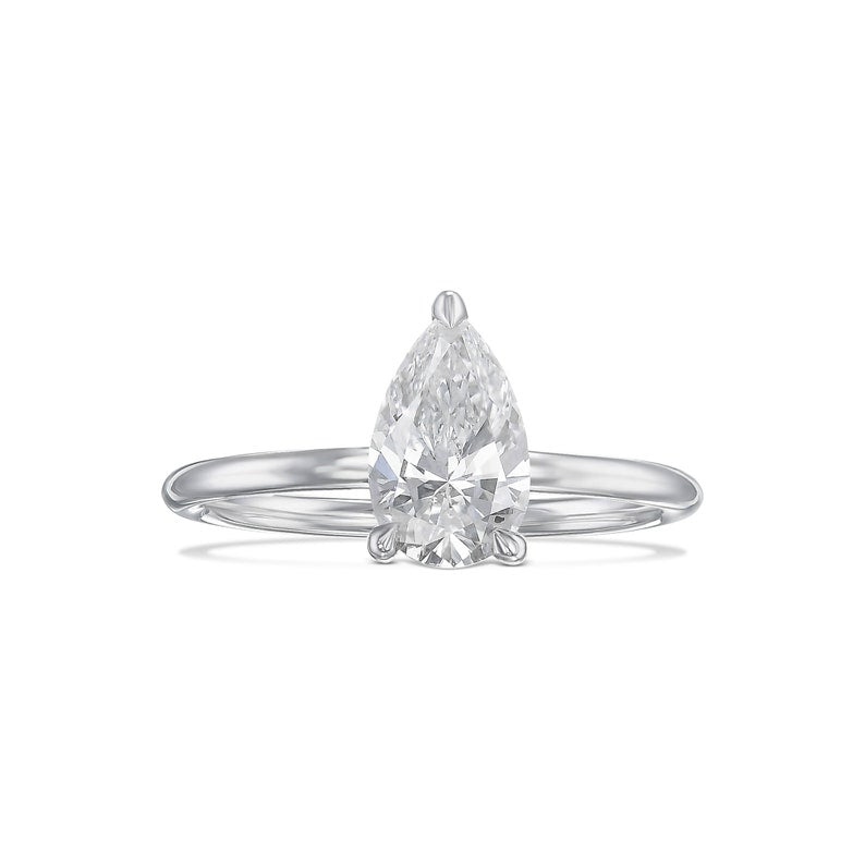 Pear cut moissanite three claw solitaire engagement ring on a plain white gold band