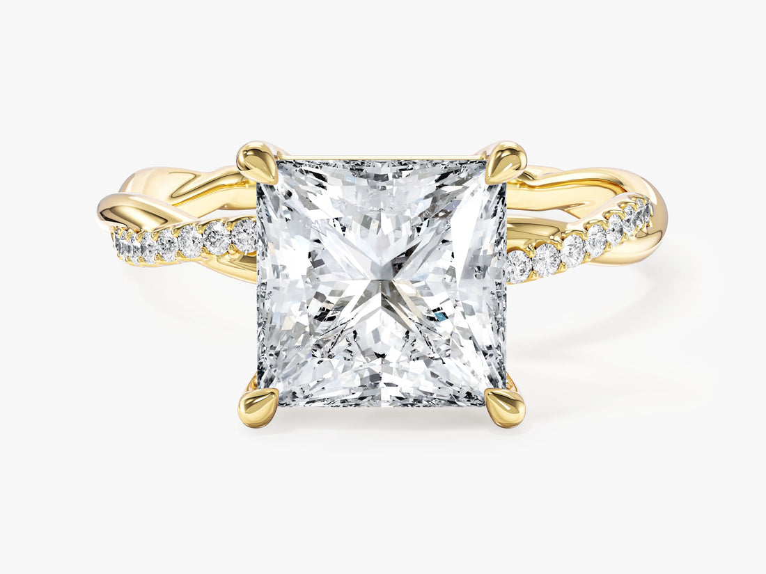 Large princess cut moissanite engagement ring with twisted micro pave band in 14K yellow gold, front view