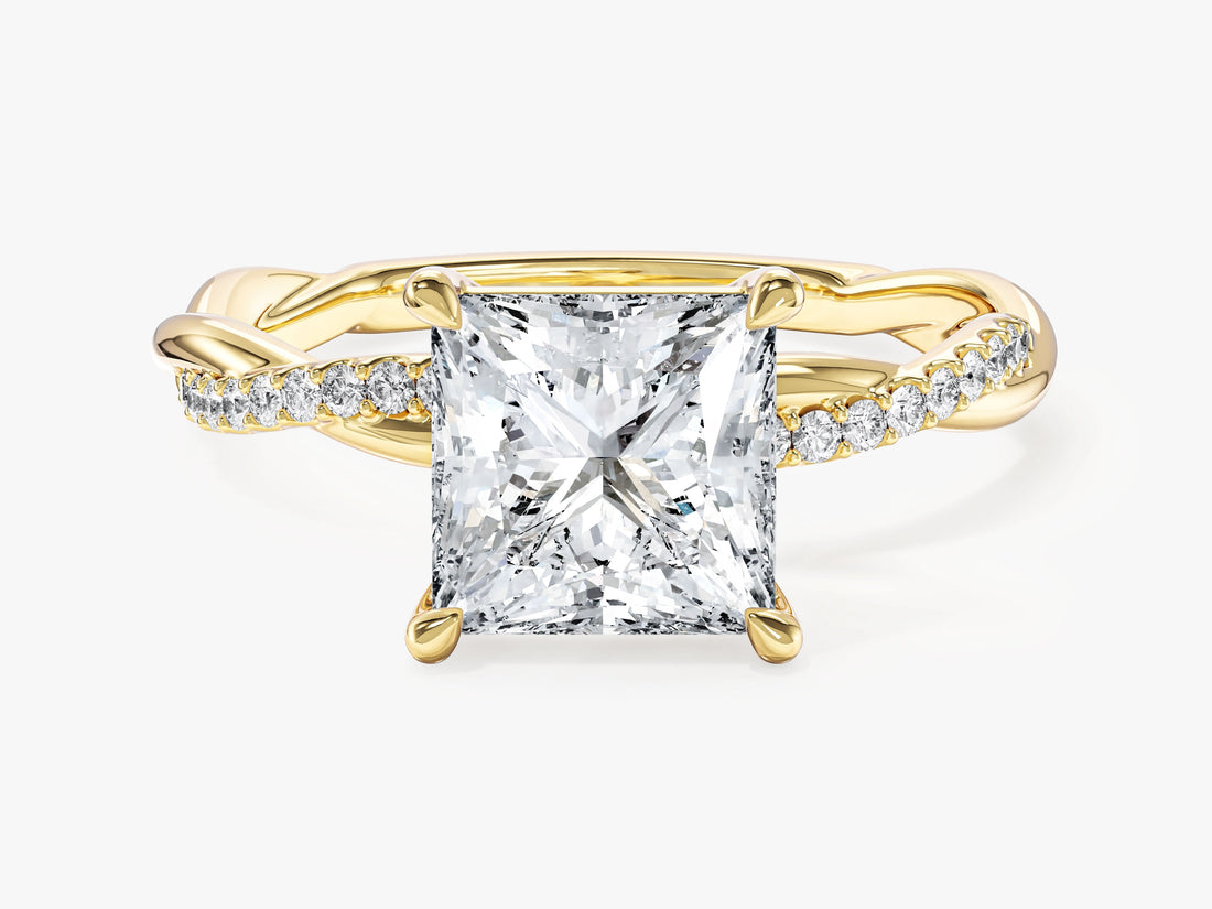 Princess cut lab grown diamond four claw engagement ring with infinity twist pave band in yellow gold, front view