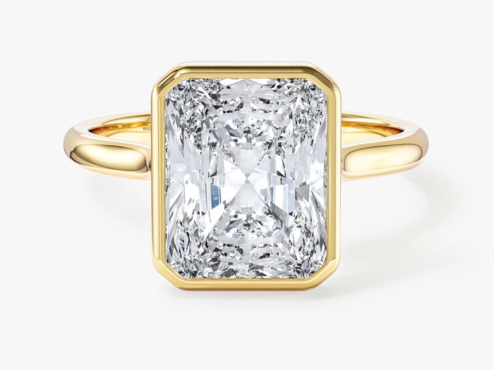 Radiant moissanite bezel engagement ring with polished metal rim and slim band in yellow gold, front view
